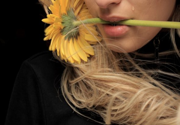 woman in black shirt with yellow hair